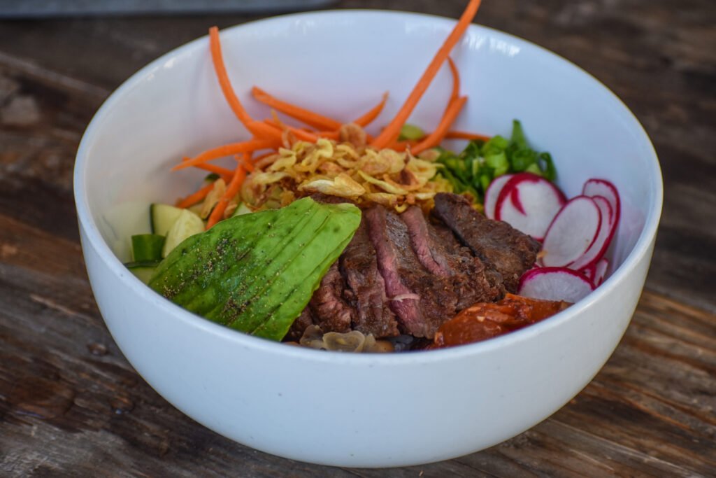 The steak and avocado bowl, with marinated, medium-rare skirt steak atop rice, from Noble Bird Rotisserie. Photo by Brian Addison.