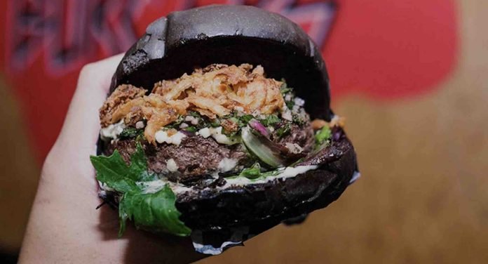 “Death to All False Burgers” is Grill ‘Em All’s metal-inspired motto. Here, the Ozzy Osbourne burger. Photo courtesy of business.