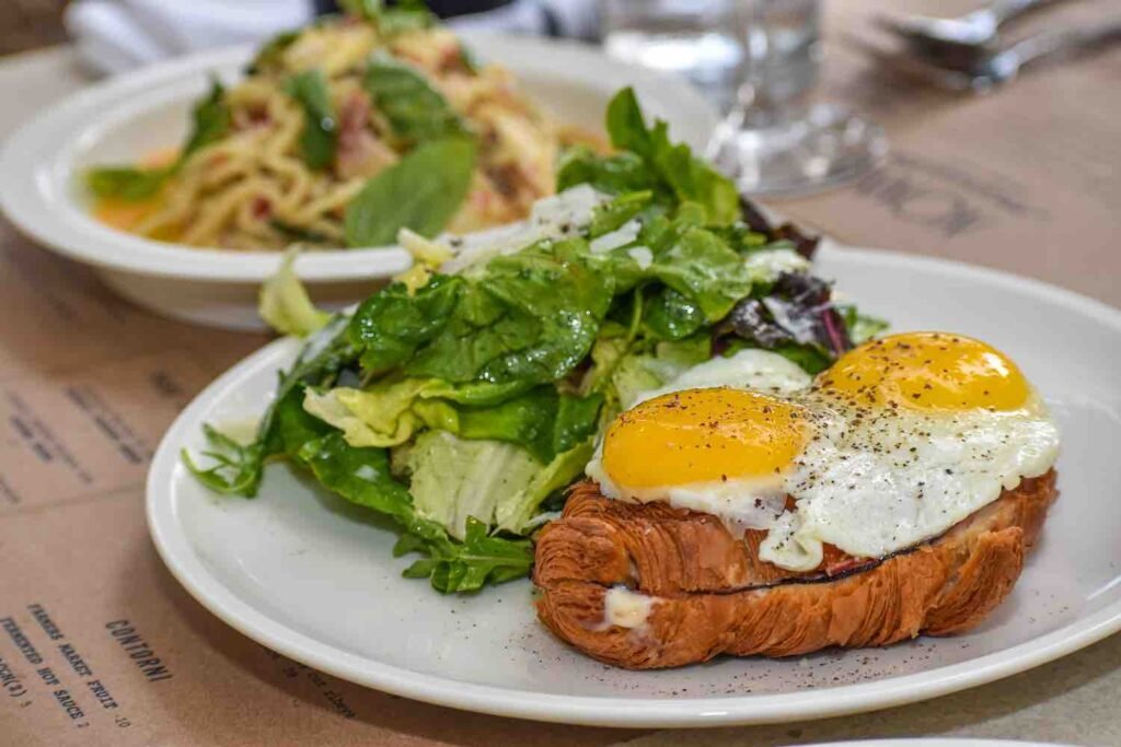 The "Croque Seniora," a croissant-based, taleggio-inspired play on the Croque Madame from Nonna Mercato. Photo by Brian Addison.