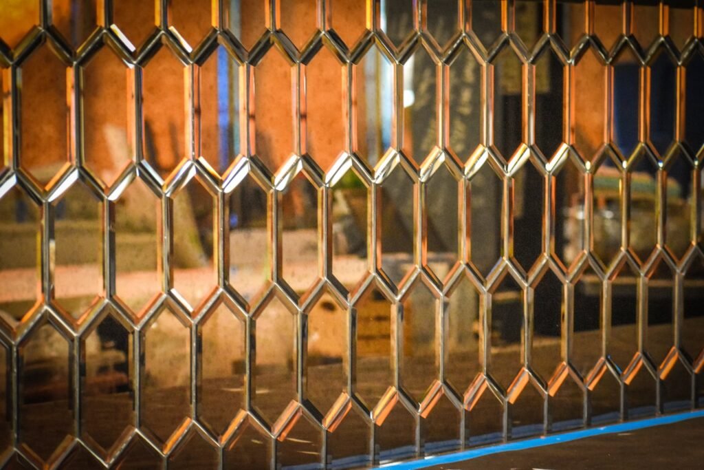 These copper-esque mirror details will be throughout the Broken Spirits Distillery space. Photo by Brian Addison.