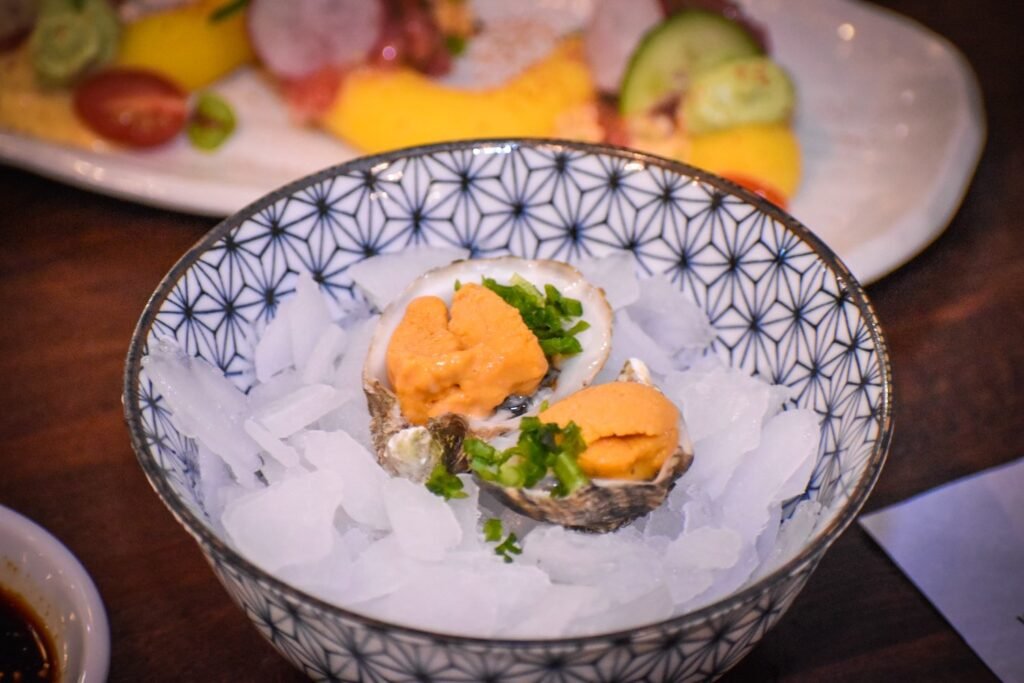 Oysters with sea urchin from Sushi Nikkei. Photo by Brian Addison.