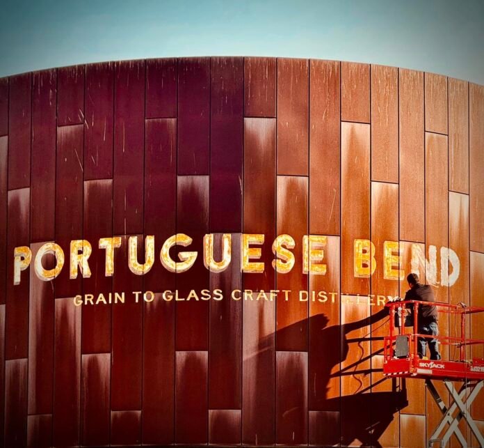Crews begin to remove the former Portuguese Bend signage. Photo by Jesse Lopez/LBFS.